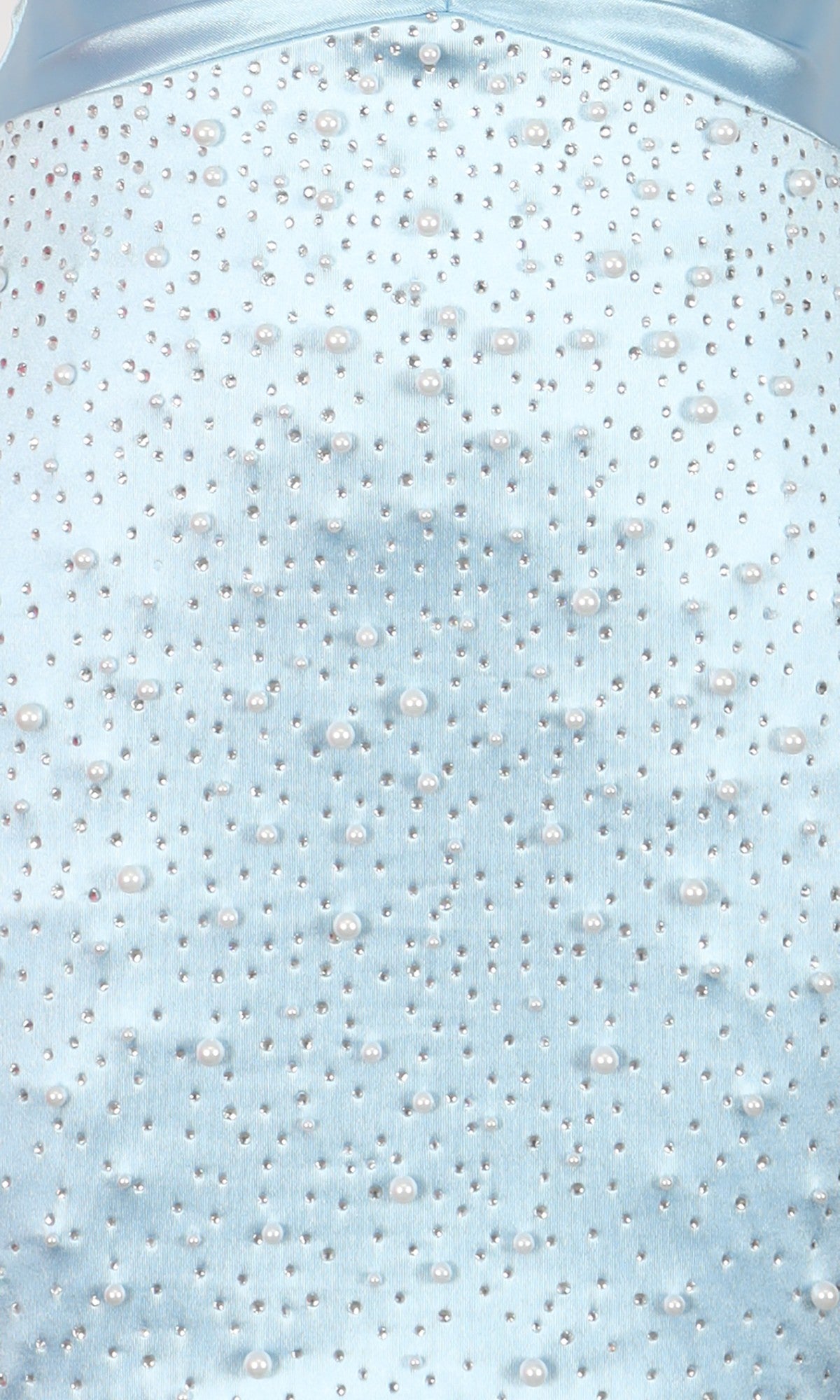 Close-up of light blue fabric from the PromGirl Exclusive 250345 short homecoming dress, featuring small beads and pearls in a scattered pattern.